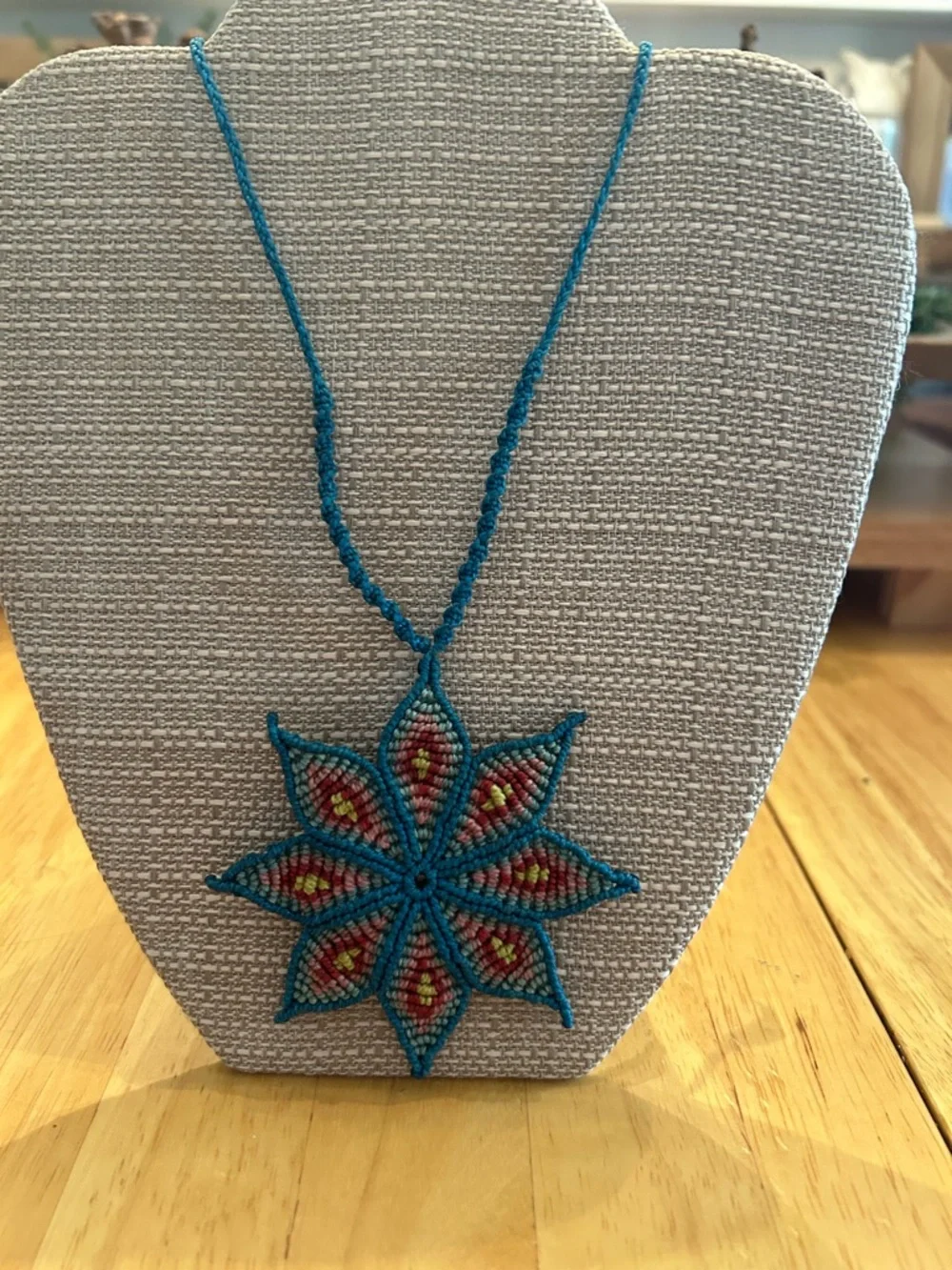 Handmade Rich Blue Macrame Flower Necklace with Red and Yellow Accents - Picture 2 of 6